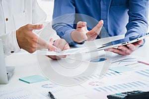 Business men meeting and discuss work project at office desk. Business professional teamwork coworkers discussing information