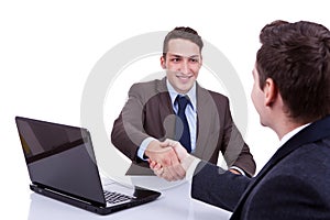 Business men reaching to an agreement