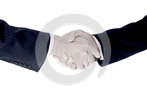 Business men shake hands wearing protective gloves