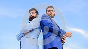 Business men stand back to back blue sky background. Impeccable appearance improves reputation professional entrepreneur
