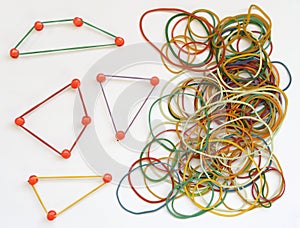 Business metaphor,networking,innovation,idea,consulting, human resources concept with drawing pins and rubber bands, some forming