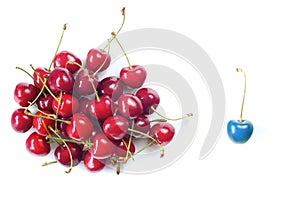 Business metaphor,solution,innovation,idea,consulting, bunch of cherrys with one cherry blue colored, flat lay,copy space
