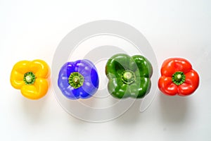 Business metaphor,solution,innovation,idea,consulting,unique features concept, row of bell peppers with one blue colored, flat lay