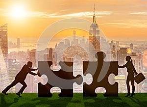 Business metaphor of teamwork with jigsaw puzzle