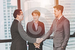Three Business man Shake hands photo