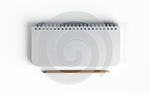 Business mock up top view of closed spiral blank recycled paper cover notebook with pencil on white desk background. 3d