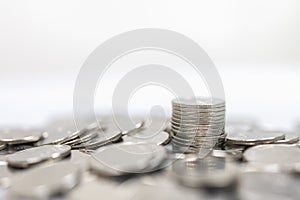 Business, Money, Finance, Security and Saving Concept. Close up of pile and stack of silver coins on white background and copy