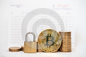 Business , Money, Technology, Security and  cryptocurrency Concept. Close up of gold bitcoin coins with master key lock and stack