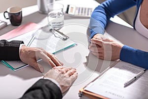 Business negotiation between businesswoman and businessman