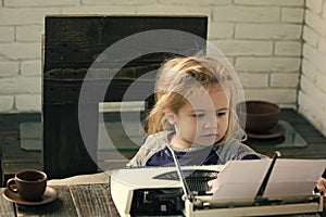 Business and new technology child or small boy or businessman kid with typewriter