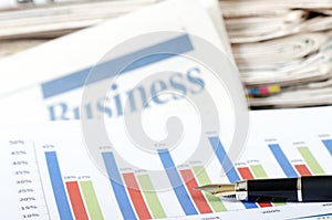 Business the newspaper with chart