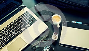 Business notebook, computer, phone, glasses, business bag