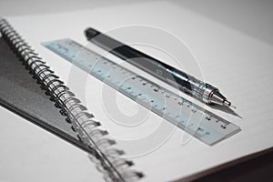 Business notebook and pencil