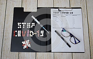 Business notepad holder with covid19 test with syringe photo