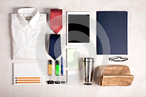 Business objects on the white desk, top view