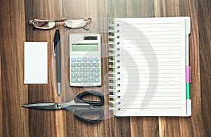 Business objects on wood background.