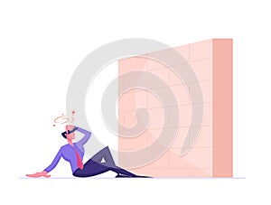 Business Obstacle and Barrier Concept. Businessman Sit on Ground with Dizzy Head front of High Brick Wall Face