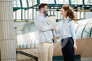 Business and office concept. Businessman and businesswoman shaking hands