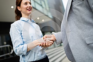 Business and office concept. Businessman and businesswoman shaking hands