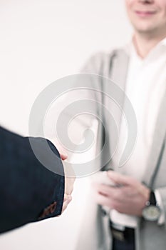 Business and office concept - businessman shaking hands