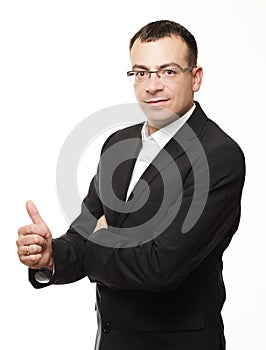 Business office concept - businessman showing thumbs up in office