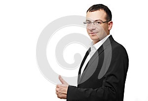 Business office concept - businessman showing thumbs up in office