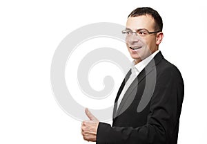 Business office concept -businessman showing thumbs up in office