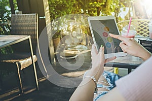 Business, office concept. Woman`s hands using tablet with infog