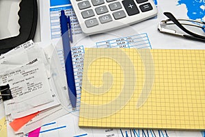 Business office desk closeup - financial reports, analysis and accounting, set of documents, tables and graphs, various items for