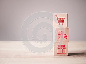 Business online shopping or e-commerce concept with online business icons on wooden cubes block,