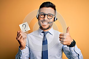 Business operator man with customer service headset from call center showing question mark happy with big smile doing ok sign,
