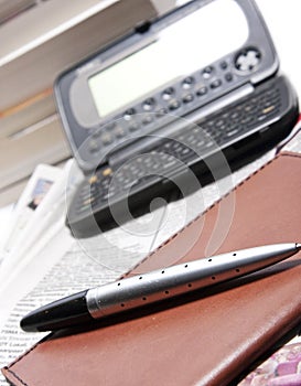 Business organizer with pen