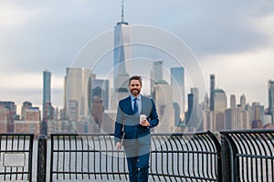 Business outdoor portrait. Middle age businessman in NYC street. Mature age, mid adult man in 40s walk at Manhattan