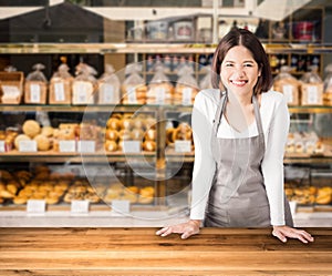 Business owner with bakery shop background