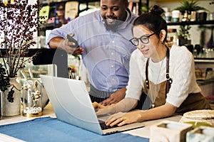 Business owner is using laptop photo