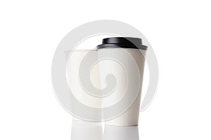 Business paper cup for hot coffee with black lid isolated on white background. White blank, large, medium and small Takeaway paper