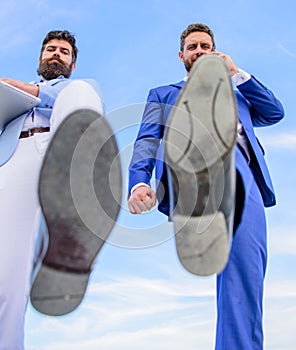 Business partner busy with phone call moving forward, foot shoe close up. Smashing competitiveness. Businessmen making