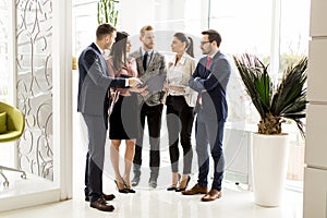 Business partners analyze the business results in modern office