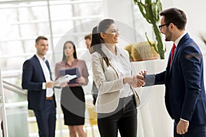 Business partners analyze the business results in modern office