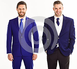 Business partners or boss and employe in suits