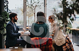 Business partners engaging in a meeting at a cafe with a modern interior