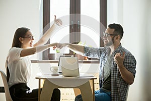 Business partners fist bumping after success good deal