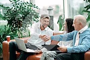 business partners greeting each other with a handshake.