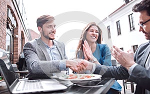 business partners greeting each other with a handshake