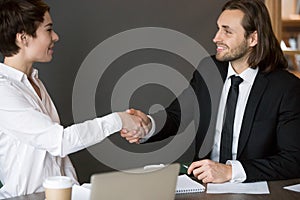 Business partners handshaking after closing successful deal