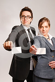 Business partners holding blank cards