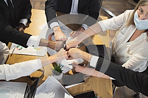 Business partners making fist bump during meeting