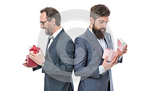 business partners on meeting isolated on white. bearded men hold valentines present. mature male businessmen in formal