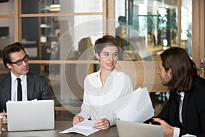 Business partners negotiating during meeting in boardroom