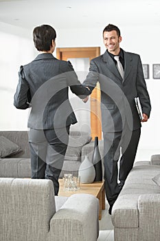 Business partners shaking hands